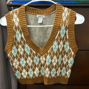 This is a waist length, v neck sweater.